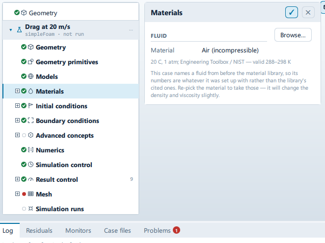 The Materials panel open beside the setup tree, showing the Fluid and Regions sections.